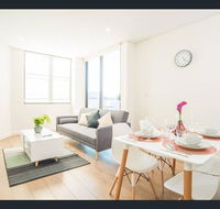 Gorgeous modern brand new two bedroom apartment with large lounge and private garden view balcony - Hotel Accommodation