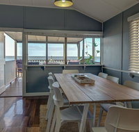 Sublime Beachfront Queenslander on the Esplanade - Hotel Accommodation